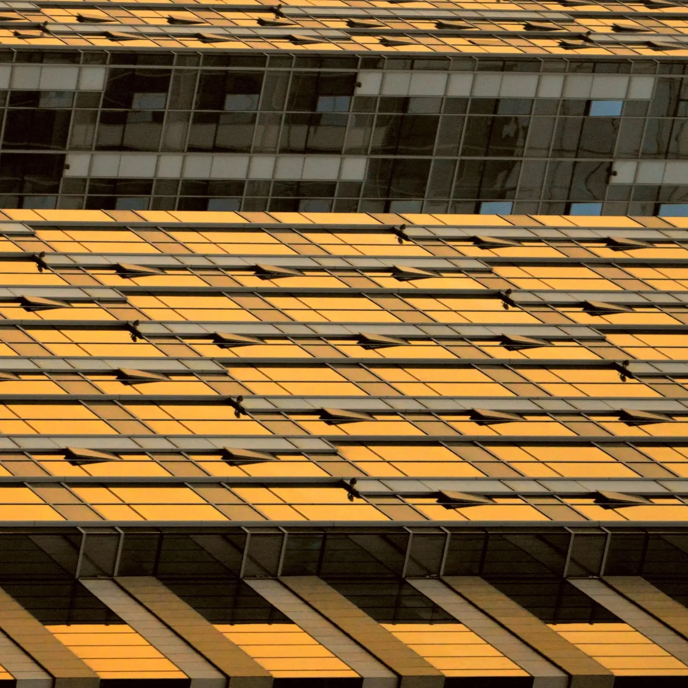 Golden glass facades of high-rise buildings